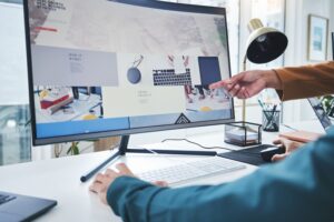 Hands, teamwork and computer for training, coaching or pointing to website design feedback online. .
